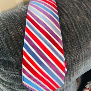 3 ties of varying colors and designs